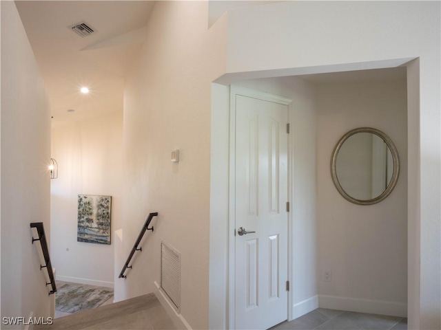 stairs with tile patterned flooring