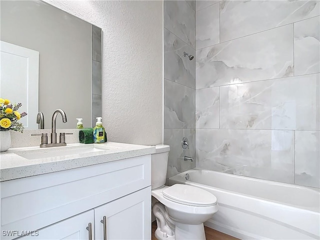 5006 S Peachtree Cir, Labelle, FL 33935 - full bathroom with a textured wall, toilet, shower / bathtub combination, and vanity