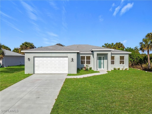 5006 S Peachtree Cir, Labelle, FL 33935 - view of front of property with concrete driveway, an attached garage, a front yard, and stucco siding