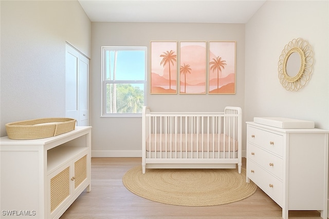 5006 S Peachtree Cir, Labelle, FL 33935 - bedroom with light wood-style flooring and baseboards