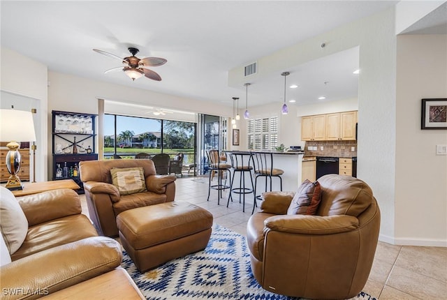 tiled living room featuring ceiling fan