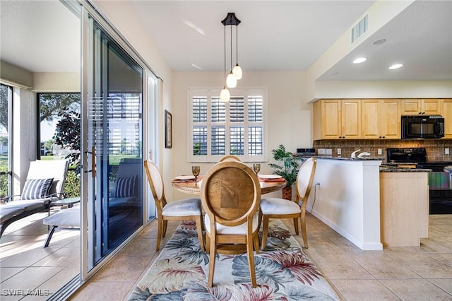 dining space with light tile patterned flooring