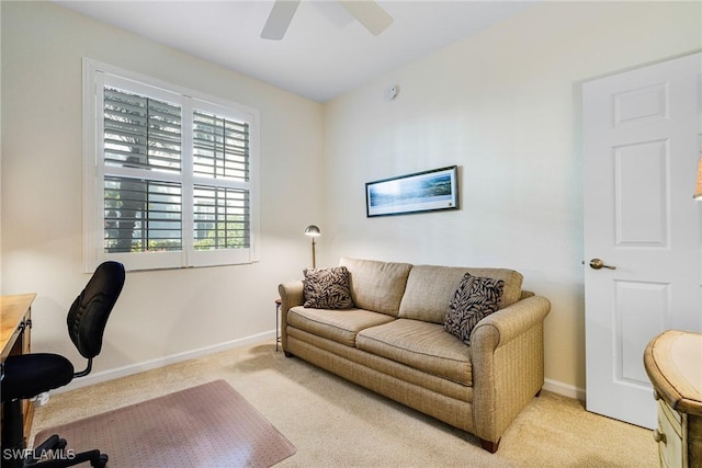 home office featuring light colored carpet and ceiling fan