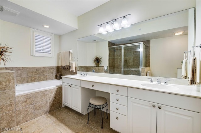 bathroom with vanity, plus walk in shower, and tile patterned flooring