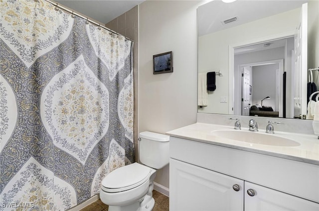 bathroom featuring vanity and toilet