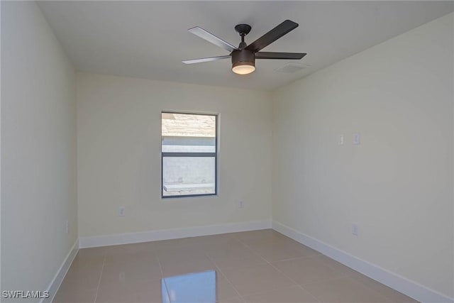 unfurnished room with light tile patterned floors, ceiling fan, visible vents, and baseboards