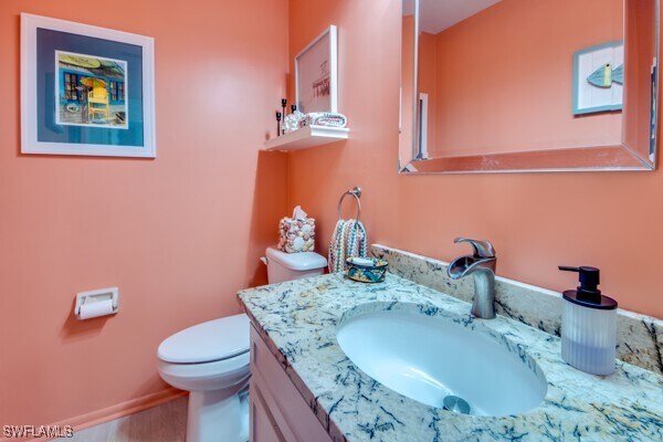 bathroom featuring vanity and toilet