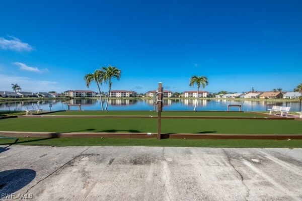 surrounding community with a water view