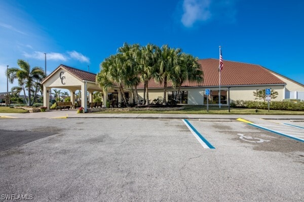 view of building exterior featuring uncovered parking