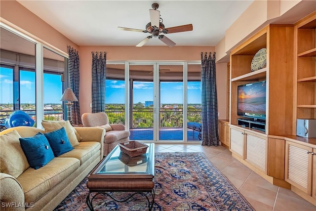 tiled living room with ceiling fan