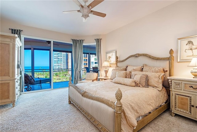 carpeted bedroom with ceiling fan and access to outside