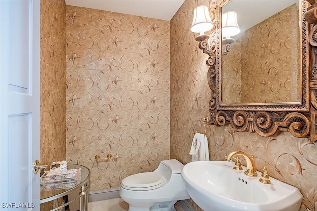 bathroom with toilet and sink