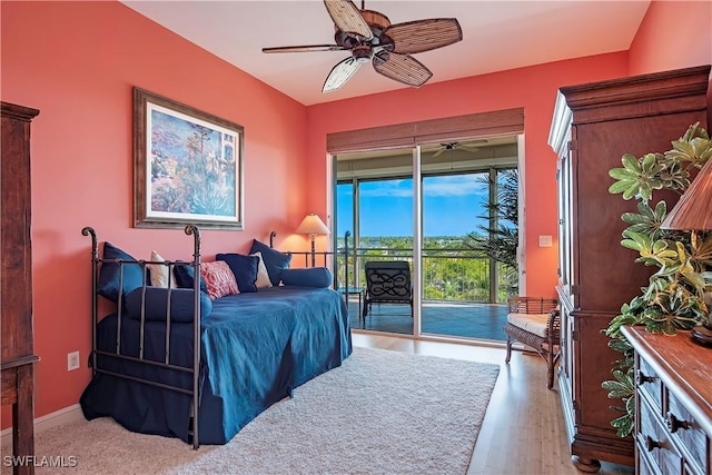 bedroom with ceiling fan, access to outside, and light wood-type flooring