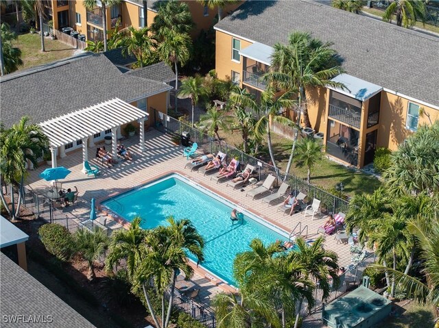 12658 Kenwood Ln Unit D, Fort Myers, FL 33907 - community pool featuring a patio area and a pergola