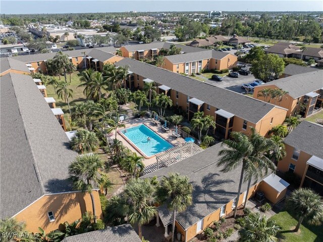 12658 Kenwood Ln Unit D, Fort Myers, FL 33907 - aerial perspective of suburban area featuring a pool area