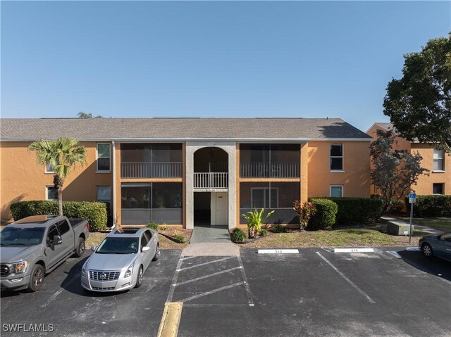 12658 Kenwood Ln Unit D, Fort Myers, FL 33907 - view of building exterior featuring uncovered parking