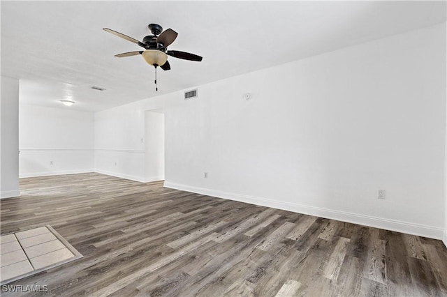 unfurnished room with hardwood / wood-style flooring and ceiling fan