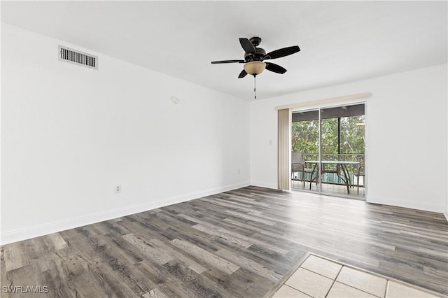 spare room featuring ceiling fan and light wood-type flooring