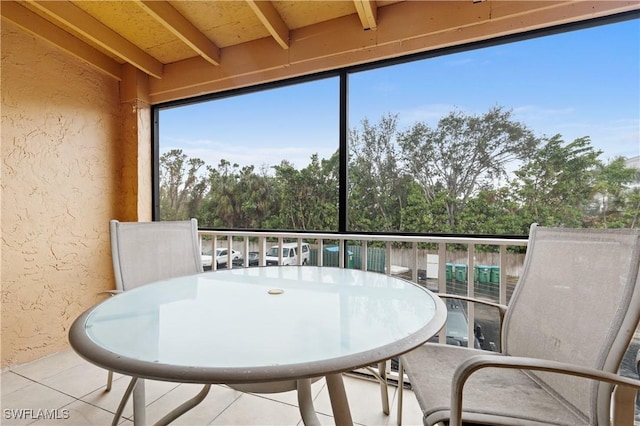 sunroom / solarium with beamed ceiling