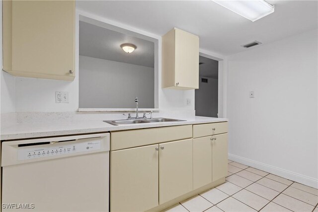 12658 Kenwood Ln Unit D, Fort Myers, FL 33907 - kitchen featuring white dishwasher, a sink, light countertops, cream cabinetry, and light tile patterned floors