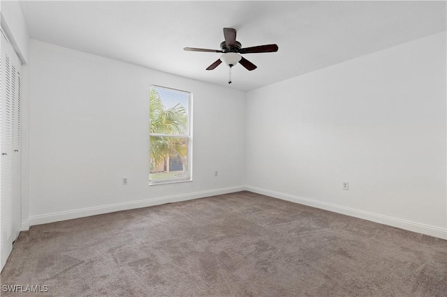 spare room with light carpet and ceiling fan