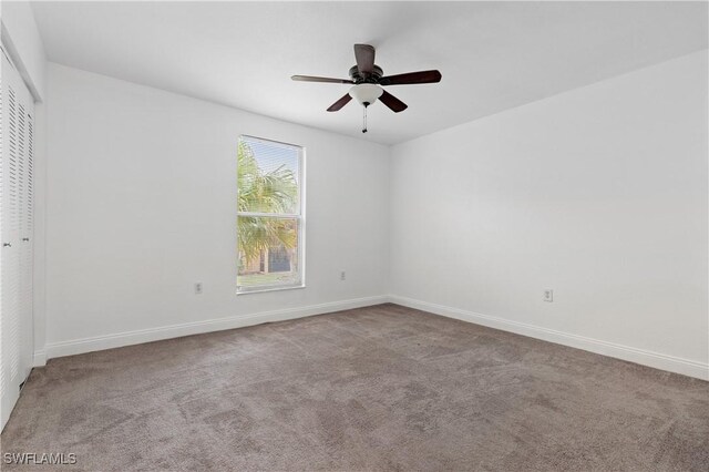 12658 Kenwood Ln Unit D, Fort Myers, FL 33907 - unfurnished bedroom with carpet floors, a closet, and baseboards