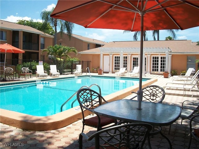 view of pool featuring a pergola and a patio area