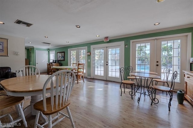 dining room featuring french doors and a healthy amount of sunlight