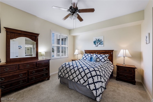 bedroom featuring ceiling fan and light colored carpet