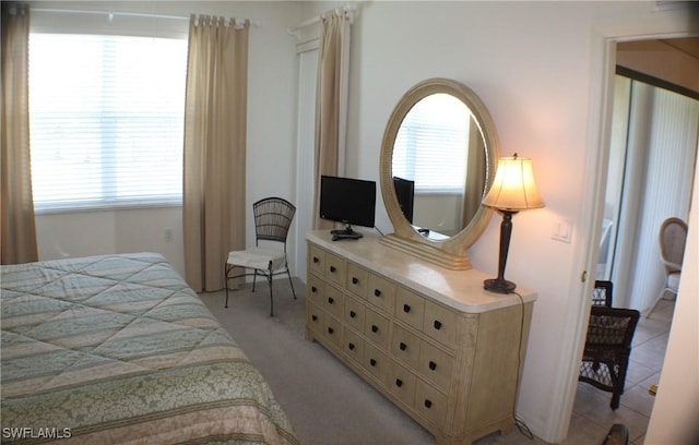 bedroom with light colored carpet