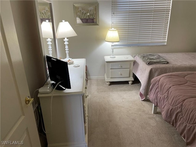 bedroom with light carpet