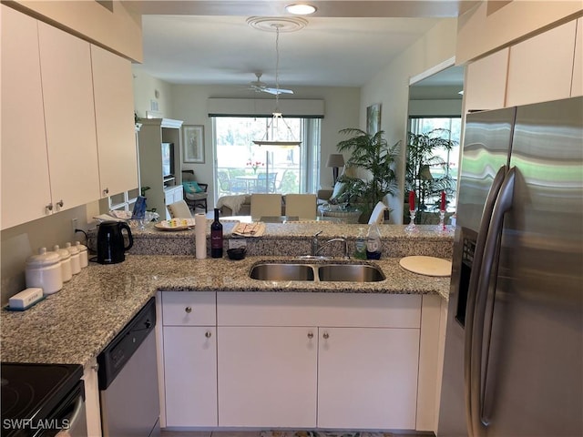 kitchen with white cabinetry, sink, and stainless steel appliances