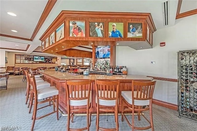 bar with crown molding and light colored carpet