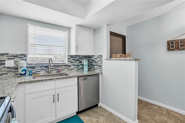 kitchen featuring stainless steel appliances, light stone countertops, sink, and white cabinets