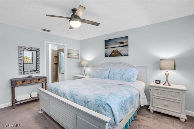 bedroom with carpet floors, a textured ceiling, and ceiling fan