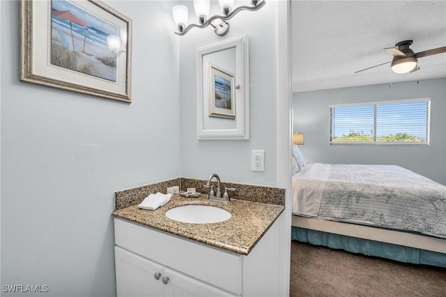 bathroom featuring ceiling fan and vanity