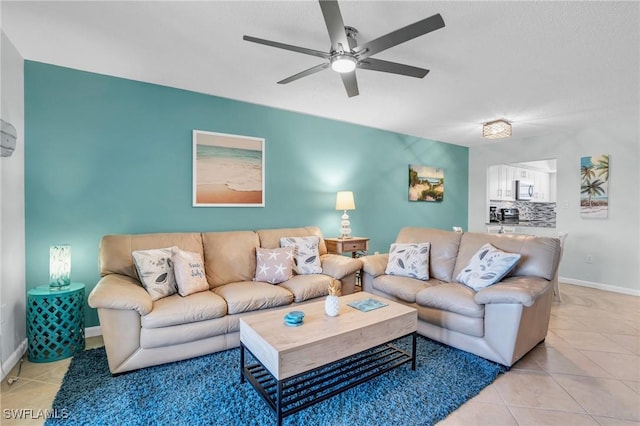 living room with light tile patterned flooring and ceiling fan