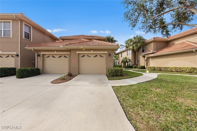 mediterranean / spanish house with a front yard