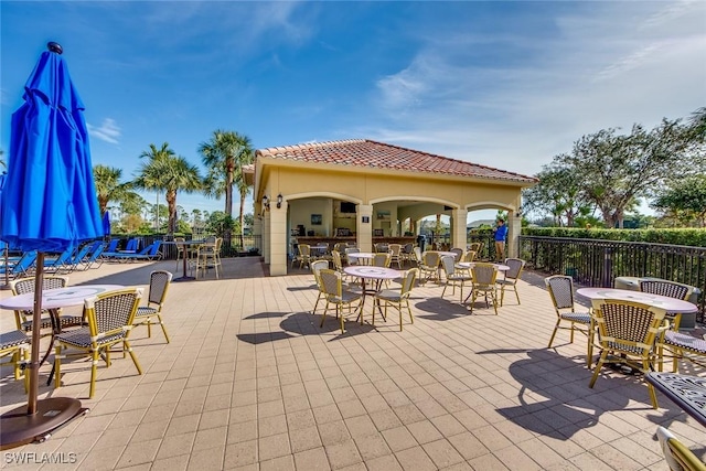 view of patio featuring an outdoor bar