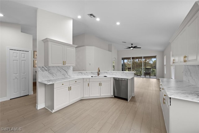 kitchen with white cabinetry, dishwasher, sink, backsplash, and kitchen peninsula