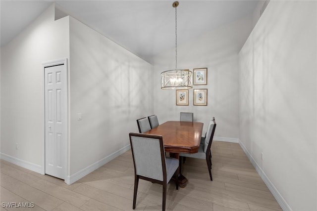 dining room featuring a notable chandelier and light hardwood / wood-style floors