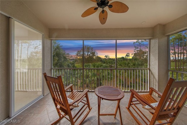 sunroom featuring ceiling fan