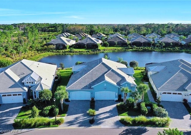 birds eye view of property with a water view