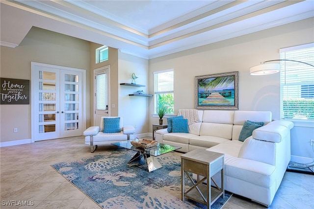 tiled living room with french doors and ornamental molding