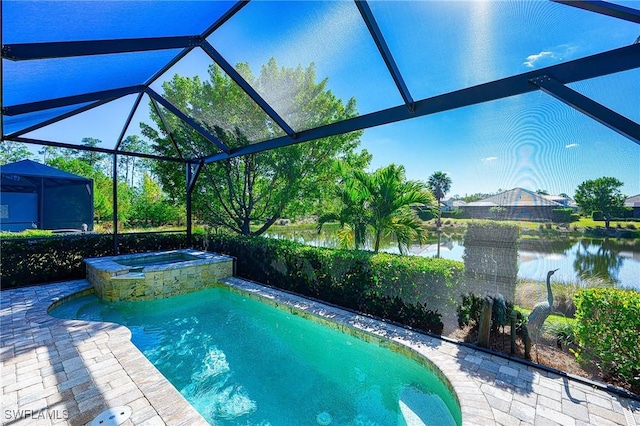 view of swimming pool with a patio area, an in ground hot tub, glass enclosure, and a water view