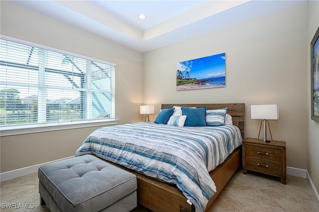 bedroom with a tray ceiling