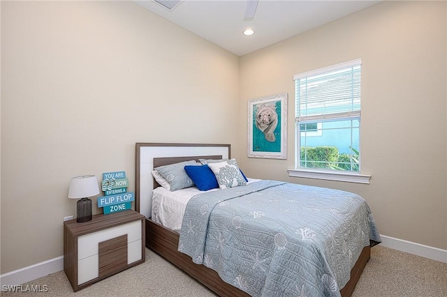 carpeted bedroom featuring ceiling fan