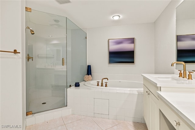 bathroom with tile patterned flooring, vanity, and independent shower and bath