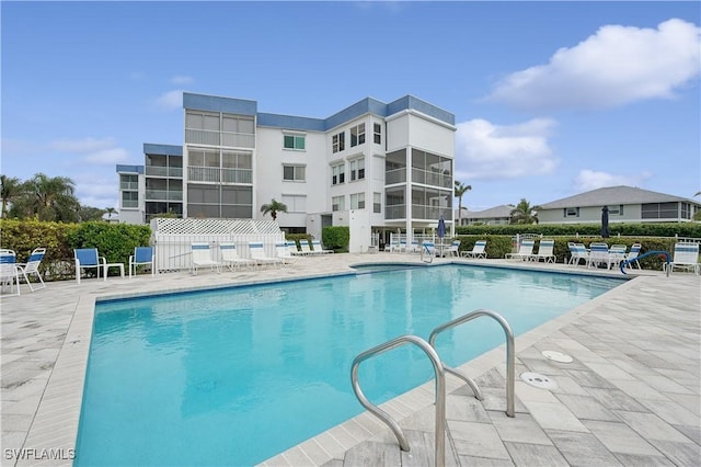 view of swimming pool with a patio