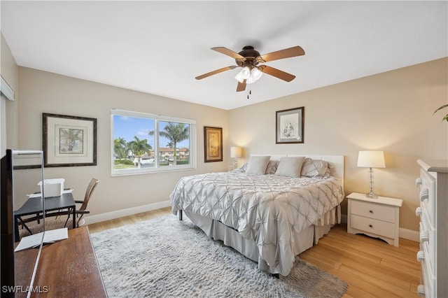 bedroom featuring light hardwood / wood-style floors and ceiling fan